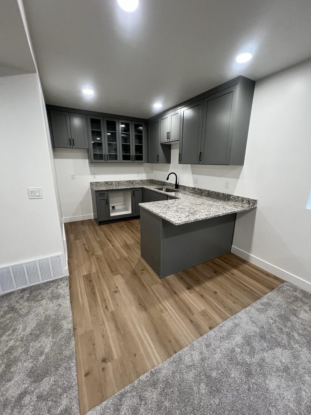 Dark basement kitchen with granite island â Rocky Mtn Remodel
