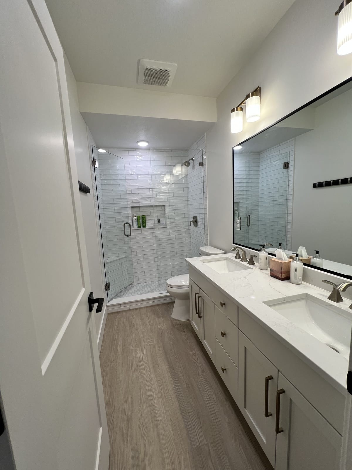 Bathroom after remodel â marble vanity and glass shower by Rocky Mtn Remodel