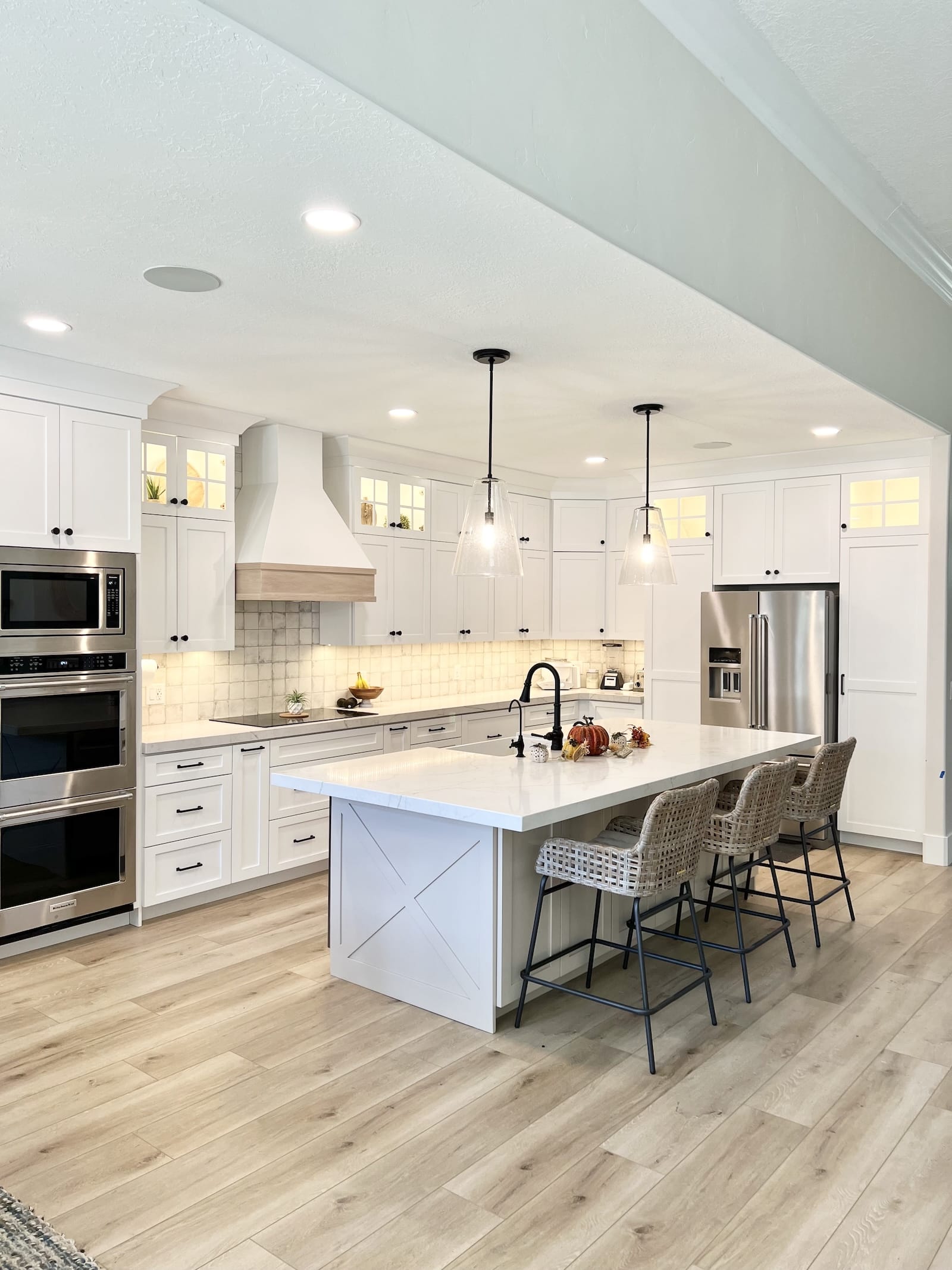 Custom kitchen renovation with white cabinets and quartz island — Rocky Mtn Remodel Utah County